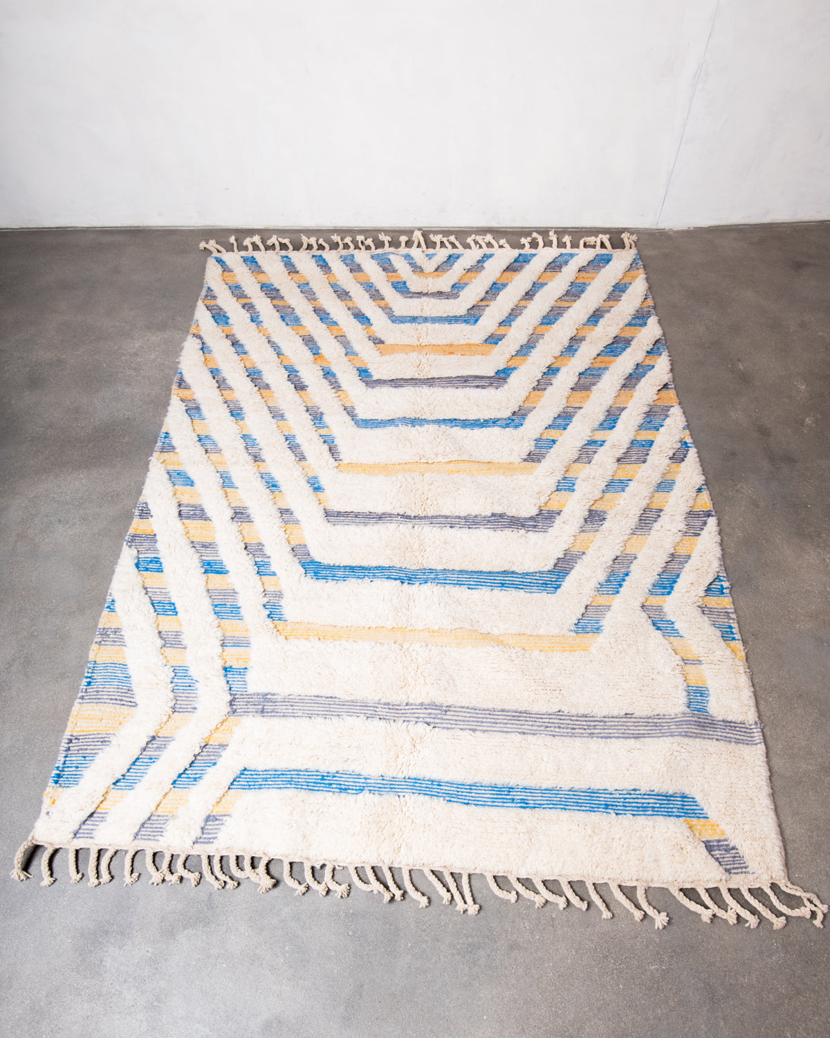 Modern, designer, handcrafted Berber rug from Morocco. Beniourain carpet with beautiful colours and patterns and fluffy wool texture.